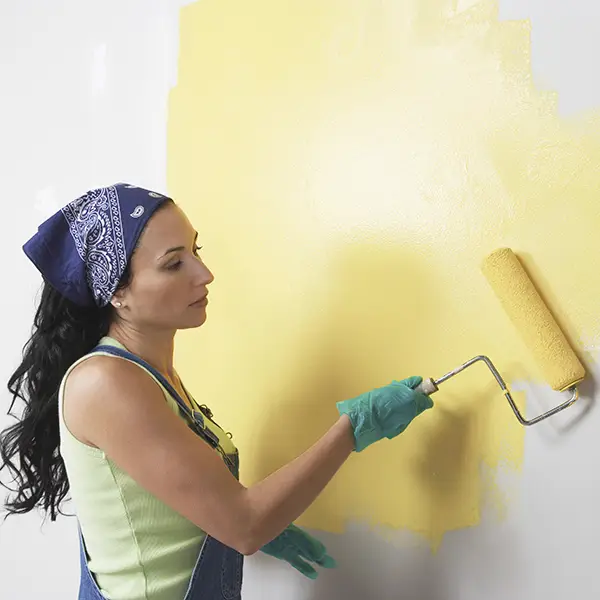 woman painting the wall